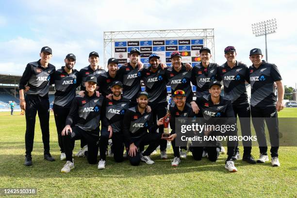 New Zealand team players pose with the trophy after winning the series at the end of the 3rd and final T20i match between West Indies and New Zealand...