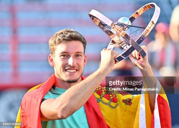 Pablo Carreno Busta of Spain holds up the National Bank Open trophy after defeating Hubert Hurkacz of Poland in the final round during Day 9 of the...
