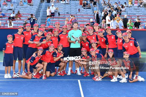 Pablo Carreno Busta of Spain poses for a photo opportunity with ball boys and ball girls after his victory against Hubert Hurkacz of Poland in the...