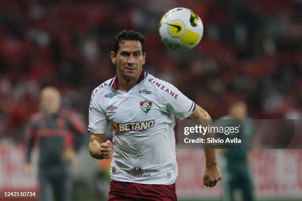Paulo Henrique Ganso of Fluminense looks at the ball during the match between Internacional and Fluminense as part of Brasileirao Series A at...