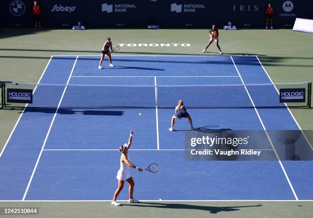 Nicole Melichar-Martinez of the United States serves, with her partner Ellen Perez of Australia, against Coco Gauff of the United States and Jessica...