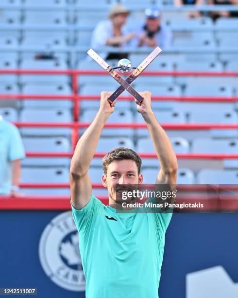 Pablo Carreno Busta of Spain holds up the National Bank Open trophy after defeating Hubert Hurkacz of Poland in the final round during Day 9 of the...