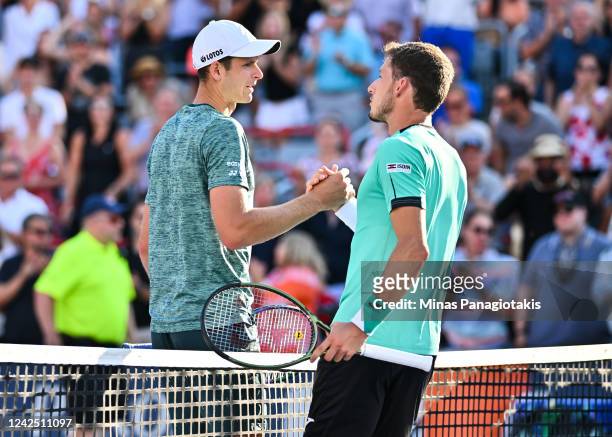 Hubert Hurkacz of Poland congratulates Pablo Carreno Busta of Spain for his victory in the final round during Day 9 of the National Bank Open at...