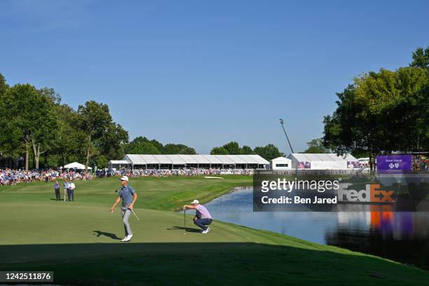 Will Zalatoris and Sepp Straka of Austria play the 18th green during the first playoff hole during the first playoff hole during the final round of...