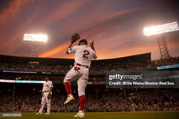 Xander Bogaerts of the Boston Red Sox warms up during sunset during the fourth inning of a game against the New York Yankees on August 14, 2022 at...