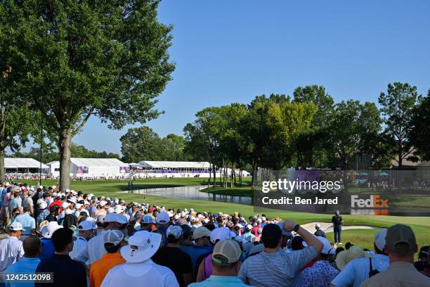 Fans watch play around the 18th green during the first playoff hole during the final round of the FedEx St. Jude Championship at TPC Southwind on...