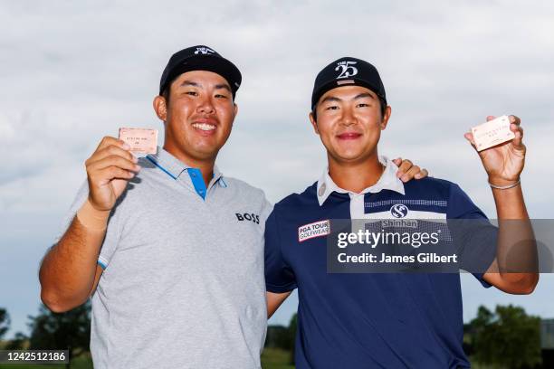 Byeong Hun An and Seonghyeon Kim of South Korea pose for a photo after the final round of the Korn Ferry Tours Pinnacle Bank Championship presented...