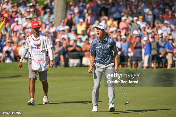 Will Zalatoris celebrates after making a putt on the 18th green during the final round of the FedEx St. Jude Championship at TPC Southwind on August...