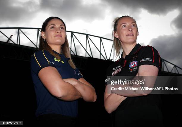 Louise Stephenson of the Hawks and Sophie Alexander of the Bombers pose during an AFLW Media Opportunity announcing the Round 1 match between...