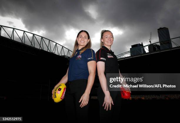 Louise Stephenson of the Hawks and Sophie Alexander of the Bombers pose during an AFLW Media Opportunity announcing the Round 1 match between...