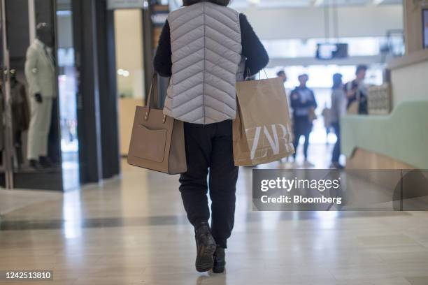 Woman carries a shopping bag at Westfield Bondi Junction Shopping Center in Sydney, Australia, on Sunday, Aug. 14, 2022....