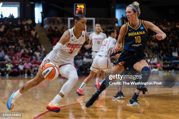 Washington Mystics guard Natasha Cloud drives to the hoop as Indiana Fever guard Lexie Hull defends during the game at the Entertainment and Sports...