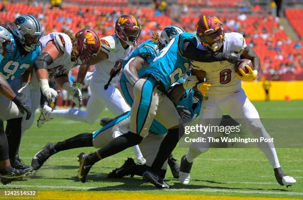 Washington Football Team running back Brian Robinson , right, scores a 2nd quarter touchdown during the Carolina Panthers defeat of the Washington...