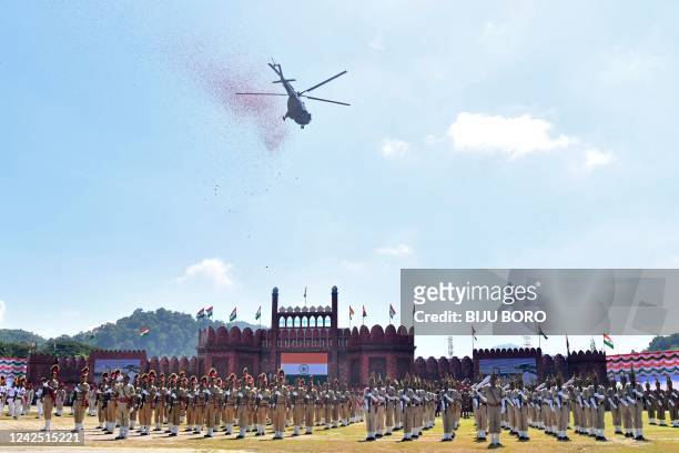 An Indian Air Force helicopter showers flower petals during the celebrations to mark countrys 75th Independence Day in Guwahati on August 15, 2022.