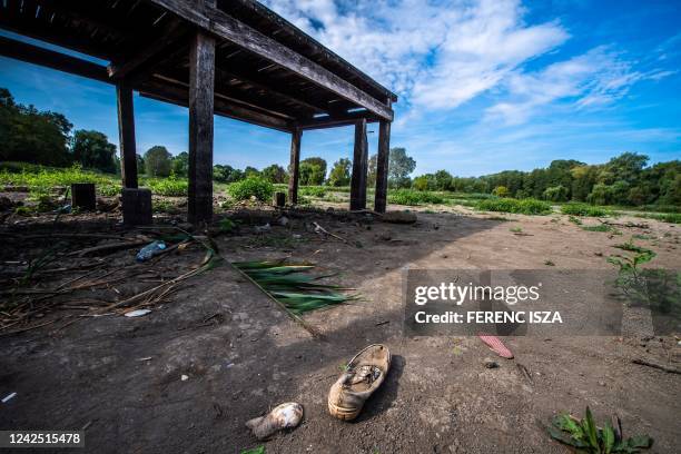 Photo taken on August 14, 2022 shows a shoe at the dried-up bed of Lake Vekeri near Debrecen, eastern Hungary. - According to Hungarian authorities,...