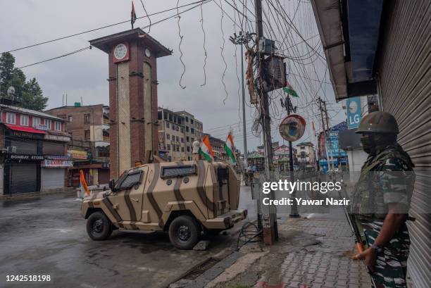 Indian paramilitary trooper stands alert in the deserted city center, during India's Independence day celebrations on August 15, 2022 in Srinagar,...
