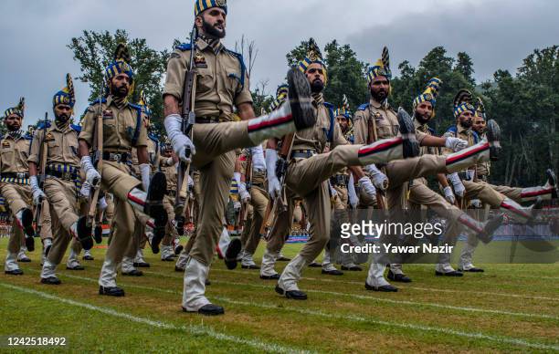 Indian policemen march at the Sher- i- Kashmir stadium where the authorities are holding the main function, during India's Independence day...