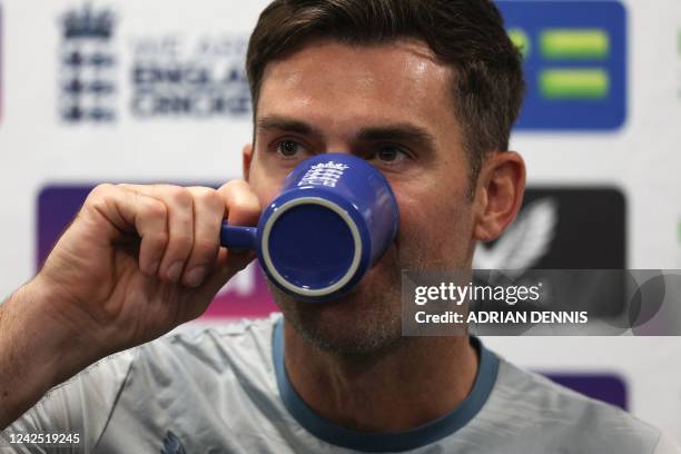 England's James Anderson drinks a beverage during a press conference at Lord's cricket ground in London on August 15, 2022 ahead of England's first...