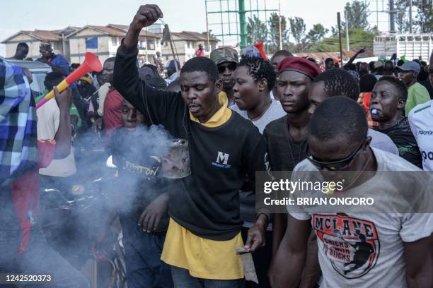 Supporters of Azimio la Umoja presidential candidate Raila Odinga react while waiting for results of Kenya's general election in Kisumu, western...