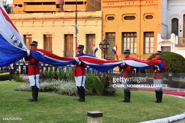Cadets of Paraguay's Acosta Ñu Military Academy hoist the national flag during a ceremony commemorating the 485th anniversary of Asuncion, at the...