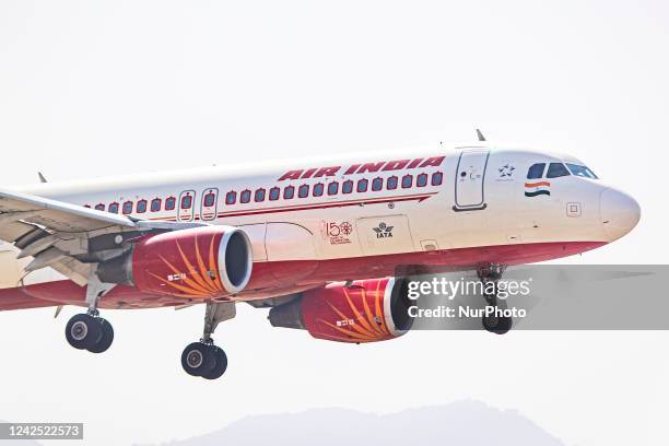 Air India Airbus A320 aircraft as seen flying over the mountains of Kathmandu valley and landing in Tribhuvan International Airport KTM. The arriving...