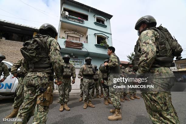 Ecuadorian soldiers guard the site of an explosion in Cristo del Consuelo neighborhood in Guayaquil, Ecuador, on August 15, 2022. - An explosion...