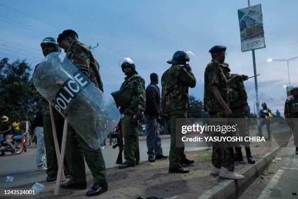 Kenyan Police officers gather to disperse supporters of Kenya's Azimio La Umoja Party presidential candidate Raila Odinga protesting the results of...