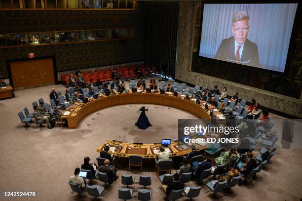 United Nations special envoy for Yemen Hans Grundberg is displayed on a screen as he attends remotely a Security Council meeting on the 'situation in...