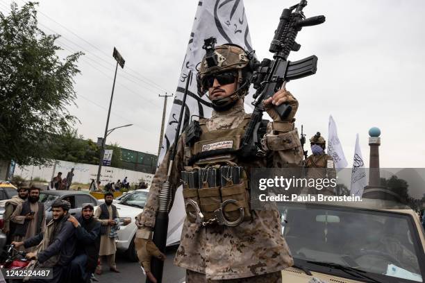 Taliban take to the streets during a national holiday celebrating the first anniversary of the Taliban takeover on August 15, 2022 in Kabul,...