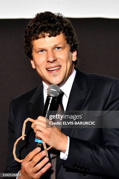 Actor and film director Jesse Eisenberg reacts after receiving his honorary "Heart of Sarajevo" award during the screening of his new film "After You...