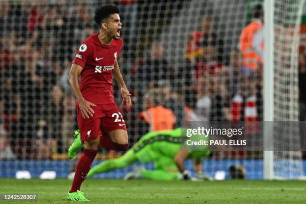 Liverpool's Colombian midfielder Luis Diaz celebrates after scoring his team first goal during the English Premier League football match between...