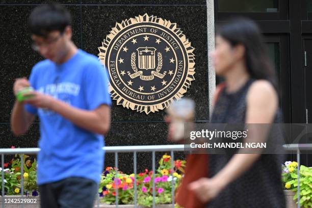 The seal of the Federal Bureau of Investigation is seen outside of its headquarters in Washington, DC on August 15, 2022. - Threats against the FBI...