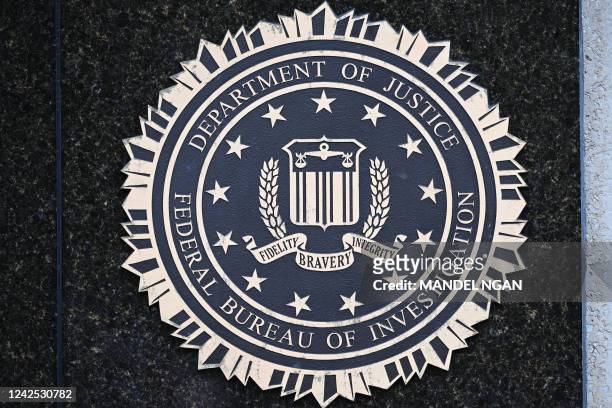 The seal of the Federal Bureau of Investigation is seen outside of its headquarters in Washington, DC on August 15, 2022. - Threats against the FBI...