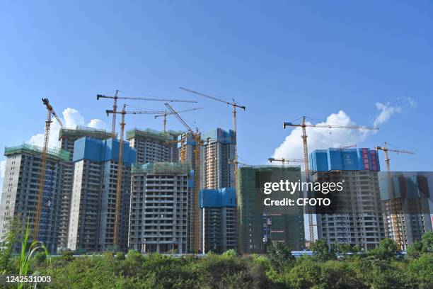 Real estate complex under construction is seen in an urban area in Nanning, South China's Guangxi Zhuang autonomous region, Aug 15, 2022. The area of...