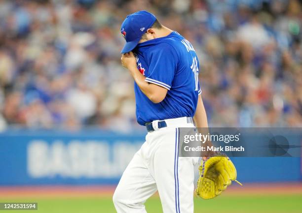 Yusei Kikuchi of the Toronto Blue Jays reacts after being taken out of the game against the Baltimore Orioles in the fourth inning at the Rogers...