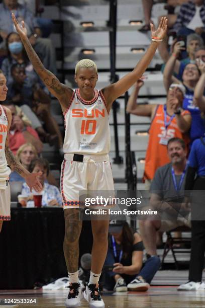 Connecticut Sun guard Courtney Williams dances to the YMCA song while waiting for the outcome of a video review during a WNBA game between the...