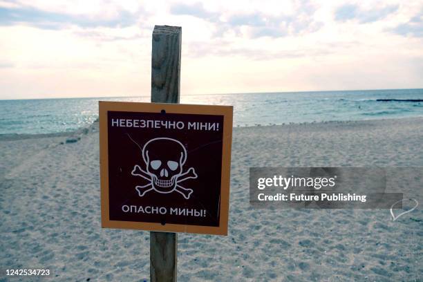 The 'Danger Mines!' sign is pictured at a beach, Odesa, southern Ukraine. This photo cannot be distributed in the Russian Federation.