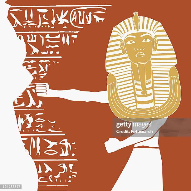 person wearing a mask of tutankhamen - tutankhamun stock illustrations