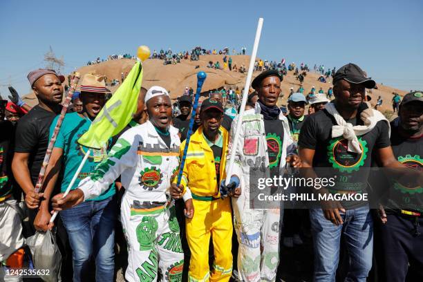 Mineworkers affiliated the Association of Mineworkers and Construction Union sing at the koppies in Marikana on August 16 ahead of the 10th...