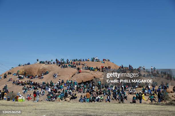 People gather on the koppies in Marikana on August 16 ahead of the 10th anniversary of the Marikana massacre. - August 16, 2022 marks 10 years since...