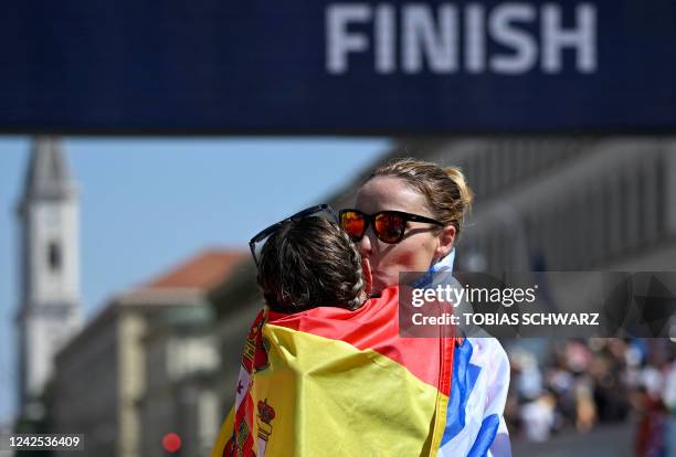 Winner Greece's Antigoni Ntrismipioti celebrates with second placed Spain's Raquel Gonzalez after the women's 35km Race Walk during the European...