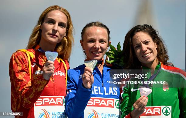 Second placed Spain's Raquel Gonzalez, winner Greece's Antigoni Drisbioti and third placed Hungary's Viktoria Madarasz celebrate on the podium after...