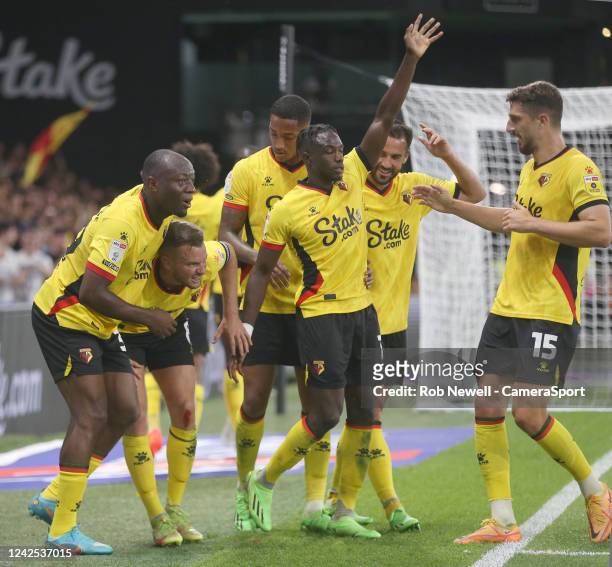 Watford's Tom Cleverley celebrates scoring his side's first goal but is also in pain after sustaining an injury during the Sky Bet Championship...