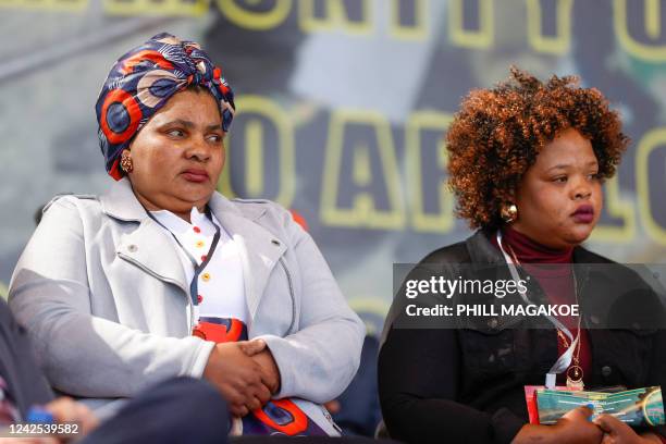 Family members of the deceased mineworkers that were affiliated to Association of Mineworkers and Construction Union look on in Marikana on August 16...