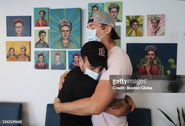 Providence, RI Luke Robins, right, embraces his partner Anthony Paiva as they pose for a portrait together after being vaccinated for Monkeypox at...
