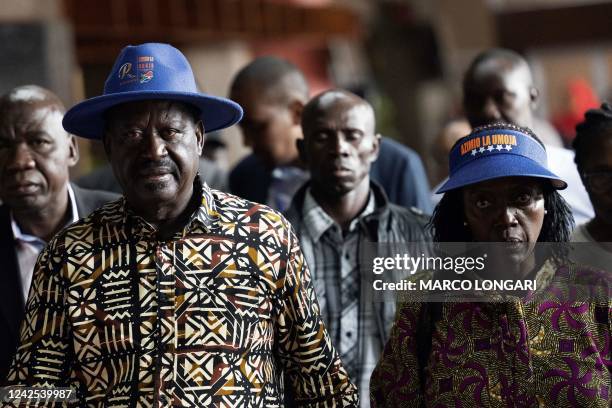 Kenya's defeated presidential candidate Raila Odinga and his running mate Martha Karua arrive ahead of Odinga's address at the Kenyatta International...