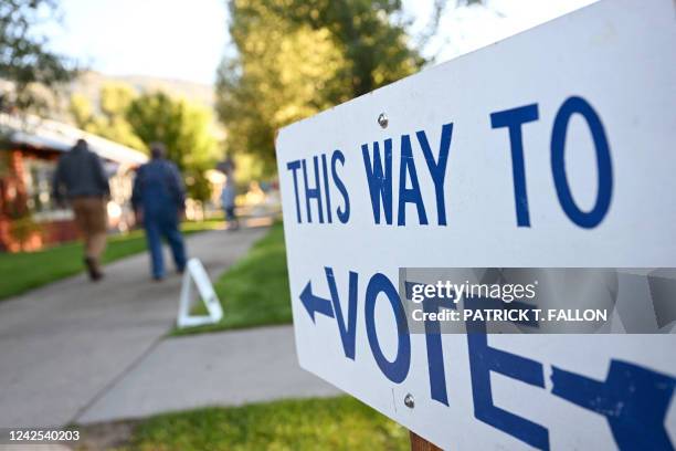 Sign reading "This Way To Vote" is displayed outside the Old Wilson Schoolhouse Community Center in Wilson, Wyoming, on August 16 as Wyoming holds...