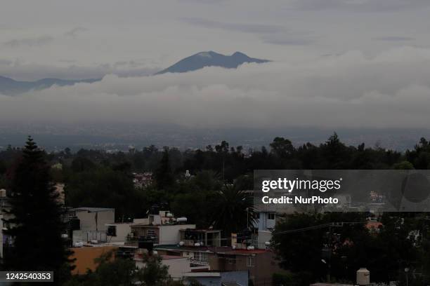 In the background, a panoramic view of the mountains in the Ajusco and Topilejo areas at dawn in Mexico City due to the monsoon that generated heavy...