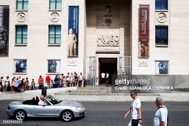 People queue at the entrance of the Museo Nazionale della Magna Grecia in Reggio Calabria on August 16, 2022 - Italy marks 50 years since the...