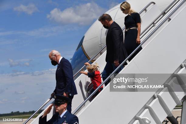 President Joe Biden, his grandson Beau Biden, his son Hunter Biden, and Melissa Cohen, wife of Hunter Biden, disembark Air Force One upon arrival at...